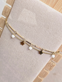 Bracelet 3 rangs doré breloques étoiles et perles blanches