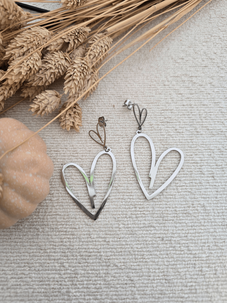 Boucles d’oreilles pendantes double cœur