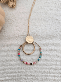 Collier pendentif rond avec perles