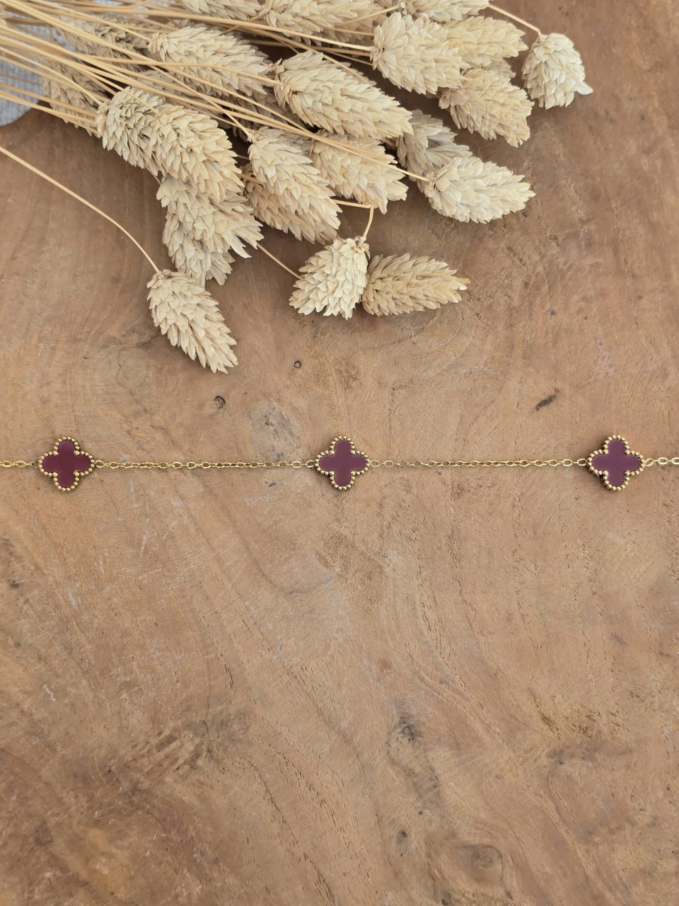 Collier fleur trèfle bordeaux 